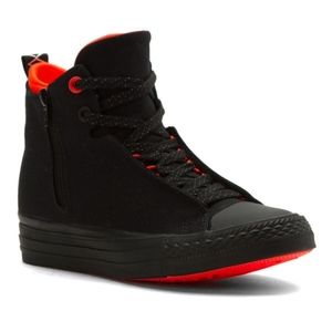 Black high top Converse with bright coral detail